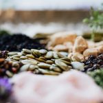 Close-up of assorted spices and seeds showcasing culinary diversity.